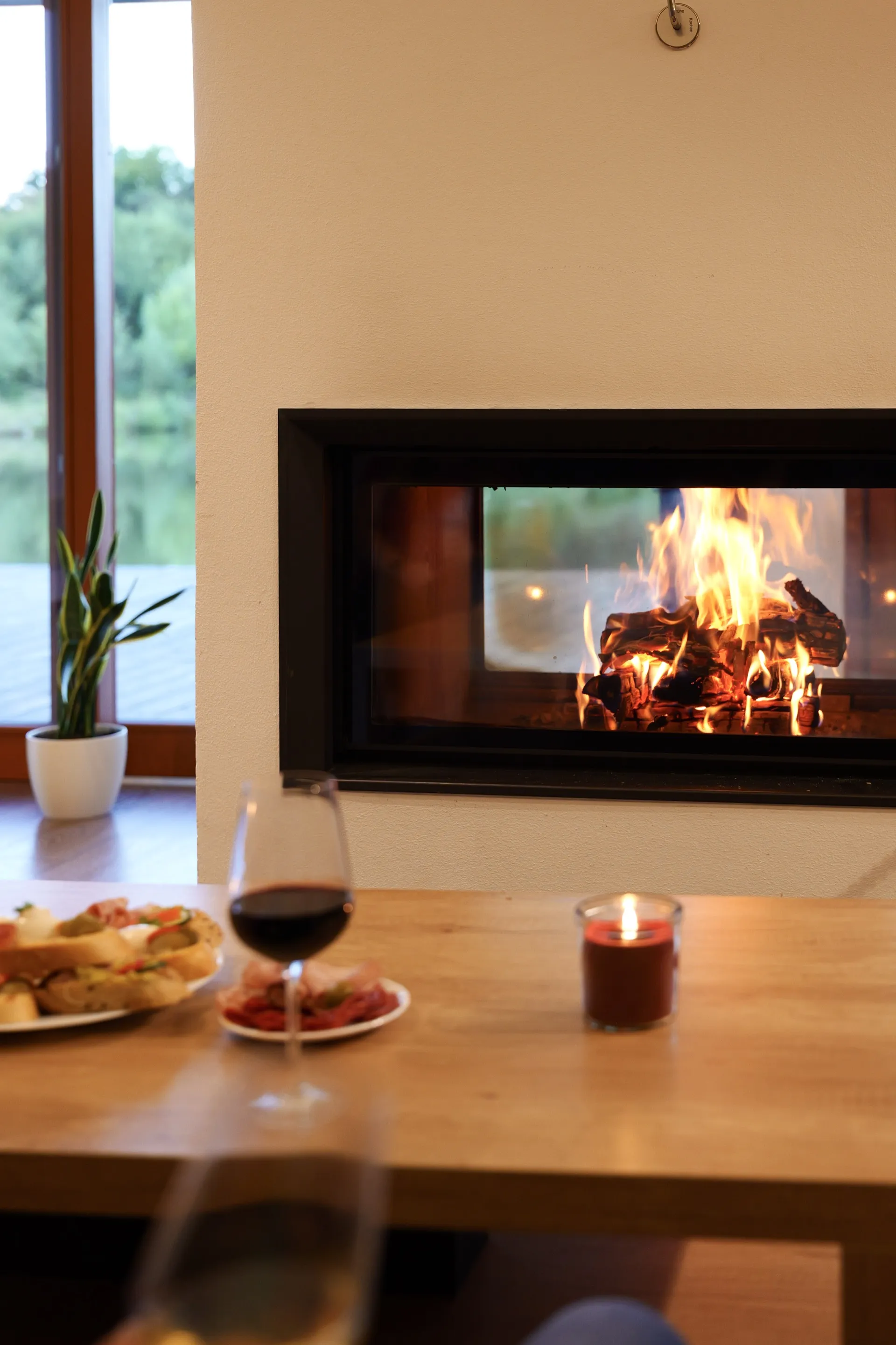 A book and calm by the fireplace at the House on the Water